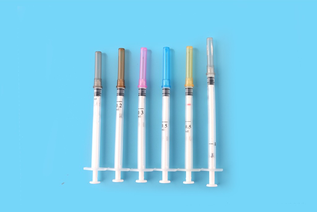 Auto disable syringe for fixed dose immunization